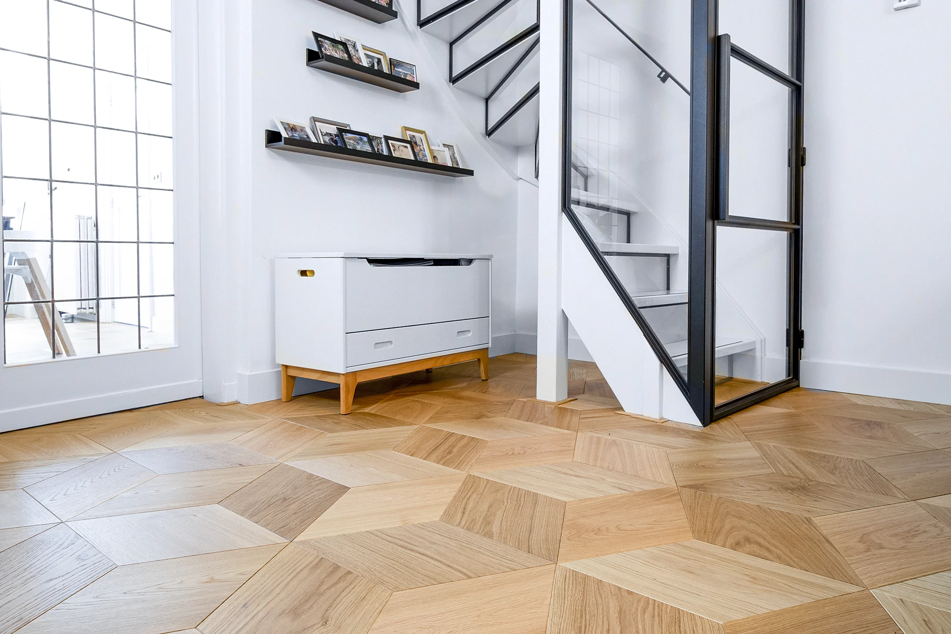 Wooden floor in unique 3D Cube pattern. Shown here with steel door and staircase.